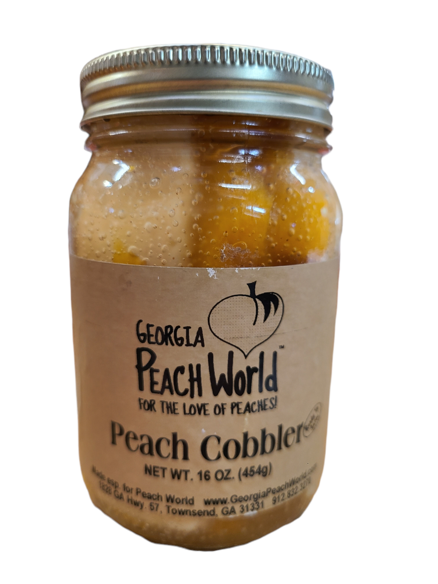 Standard ball canning jar with sealed top and screw on ring containing peach cobbler in a jar